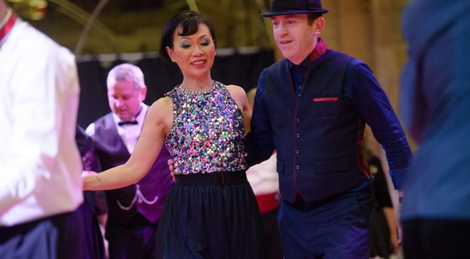 Andy and Joo-Lee enjoying a Lindy Hop dance together at the Lindy Jazz Snow Ball, celebrating the joy of swing dancing and music.